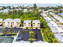 Three-story building with parking and a tennis court at 619 Cedars Ct, Longboat Key, FL 34228