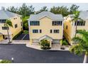 Aerial view of yellow two-story building at 619 Cedars Ct, Longboat Key, FL 34228