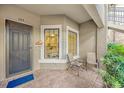 Inviting front entry with small patio and view into the kitchen at 13604 Messina Loop # 103, Lakewood Ranch, FL 34211