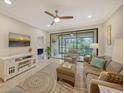 Living Room with sliding glass doors to screened patio at 13604 Messina Loop # 103, Lakewood Ranch, FL 34211