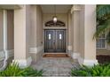 Elegant house entrance with double doors at 23095 Langdon Ave, Port Charlotte, FL 33954