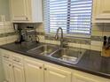 Updated kitchen with double sink, new countertops, and appliances at 3935 Lake Bayshore Dr # F-316, Bradenton, FL 34205