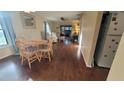 Bright dining area with wood flooring and a wooden table at 4924 Live Oak Cir # 115, Bradenton, FL 34207