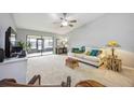 Living room with a sofa, rocking chair, and view to backyard at 6515 Heritage Ln # 2615, Bradenton, FL 34209