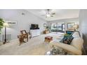 Bright living room with comfy seating and access to patio at 6515 Heritage Ln # 2615, Bradenton, FL 34209