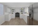 Modern kitchen with white cabinets and stainless steel appliances at 6515 Heritage Ln # 2615, Bradenton, FL 34209