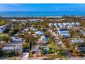 Coastal cottage with lush landscaping, near the beach at 6901 Poinsettia Ave, Longboat Key, FL 34228