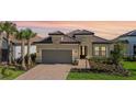 Attractive one-story home with a two-car garage and landscaping at 10128 Morning Mist Ln, Sarasota, FL 34241