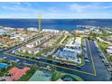 Aerial view of waterfront community with boat docks and tennis courts at 208 Lewis Cir # 4A, Punta Gorda, FL 33950