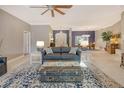 Spacious living room with grey couch and large rug at 3017 Wilderness E Blvd, Parrish, FL 34219