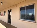 Exterior view of condo building showing condo unit entrance and windows at 3993 Lake Bayshore Dr # F513, Bradenton, FL 34205