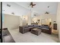 Spacious living room featuring a large sectional sofa and ample natural light at 6223 90Th Avenue E Cir, Parrish, FL 34219