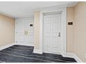 Elegant entryway with white doors and dark flooring at 800 N Tamiami Trl # 307, Sarasota, FL 34236