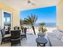 Spacious balcony with ocean view and comfortable seating at 915 Seaside Dr # 407, Sarasota, FL 34242