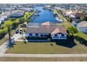 Single-story home with a canal-front view and private pool at 2711 W Marion Ave, Punta Gorda, FL 33950