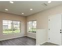 Bright living room with grey vinyl flooring and large windows at 341 Cape Harbour Loop # 108, Bradenton, FL 34212