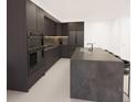 Modern kitchen with dark cabinetry, stainless steel appliances, and a large island at 4950 Remington Dr # 407, Sarasota, FL 34234