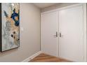 Bright entryway with double doors and contemporary art at 535 Sanctuary Dr # A202, Longboat Key, FL 34228