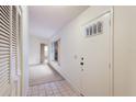 Bright entryway with tiled floor and closet at 5502 Garden Lakes Oak, Bradenton, FL 34203