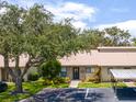 Tan house with carport and landscaping at 6016 28Th W St # 6016, Bradenton, FL 34207
