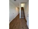Bright entryway with wood-look floors and staircase leading to the second floor at 2533 6Th Ave Drive E # 2, Bradenton, FL 34208