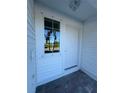 White front door entry with sidelights and brick walkway at 2533 6Th Ave Drive E # 2, Bradenton, FL 34208