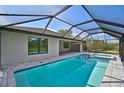 Inviting swimming pool with a screened enclosure at 414 Sunset N Rd, Rotonda West, FL 33947