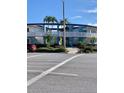 The Dorset: Building exterior showcasing its mid-century modern design and landscaping at 475 Benjamin Franklin Dr # 202, Sarasota, FL 34236