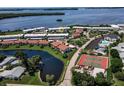 Aerial view of waterfront community with tennis courts and pool at 4767 Independence Dr # 4767, Bradenton, FL 34210