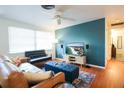 Cozy living room with a teal accent wall and comfortable seating at 560 Bradenton Rd, Venice, FL 34293