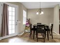 Breakfast nook with table and chairs, near kitchen and back door at 8277 Villa Grande Ct, Sarasota, FL 34243
