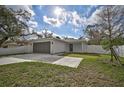 New construction home with attached garage and fenced yard at 1422 19Th St, Sarasota, FL 34234