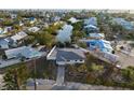 Aerial view of waterfront home and neighborhood at 251 Gladiolus St, Anna Maria, FL 34216