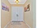 Bright and spacious entryway with double doors and artwork at 3970 Serenity Cir, Sarasota, FL 34235