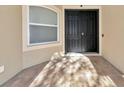 Inviting front entrance with double doors and a tiled entryway at 3970 Serenity Cir, Sarasota, FL 34235