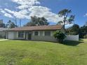 Charming ranch-style home with a spacious yard at 4121 Durant St, Port Charlotte, FL 33948