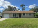 Charming ranch-style home with a spacious yard at 4121 Durant St, Port Charlotte, FL 33948