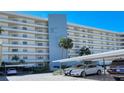Beautiful condo complex with covered parking, palm trees and well maintained grounds at 5770 Midnight Pass Rd # 705C, Sarasota, FL 34242