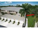 Condo building exterior with attached garage at 6310 Grand Oak Cir # 106, Bradenton, FL 34203