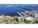 High-rise condo building near a marina and bridge, aerial view at 1400 W Barcarrota Blvd # 404, Bradenton, FL 34205