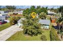 Single-Gathering home with a large yard, surrounded by lush greenery at 312 San Marie Dr, Punta Gorda, FL 33950