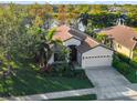 One-story home with a two-car garage and landscaped yard at 8231 Stirling Falls Cir, Sarasota, FL 34243