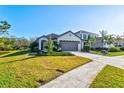 House exterior showcasing landscaping and driveway at 12926 True Blue Cir, Bradenton, FL 34211