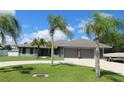 Beautiful home with a three-car garage and circular driveway at 1820 E Leewynn Dr, Sarasota, FL 34240