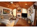Spacious living room features a fireplace and hardwood floors at 1820 E Leewynn Dr, Sarasota, FL 34240