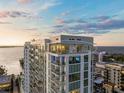 High-rise condo building with a rooftop terrace overlooking the water at 301 Quay Commons # 1904, Sarasota, FL 34236