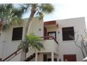 Condo building showcasing architectural details and palm trees at 304 Spring Lakes Blvd # 304, Bradenton, FL 34210