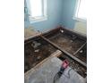 Unfinished basement area showing exposed floor joists and subfloor at 5 Palm Ave, Bradenton, FL 34208