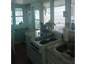 Simple kitchen with an electric range and ample counter space at 5 Palm Ave, Bradenton, FL 34208