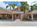 Condo building entrance with covered parking at 819 Fairwaycove Ln # 103, Bradenton, FL 34212